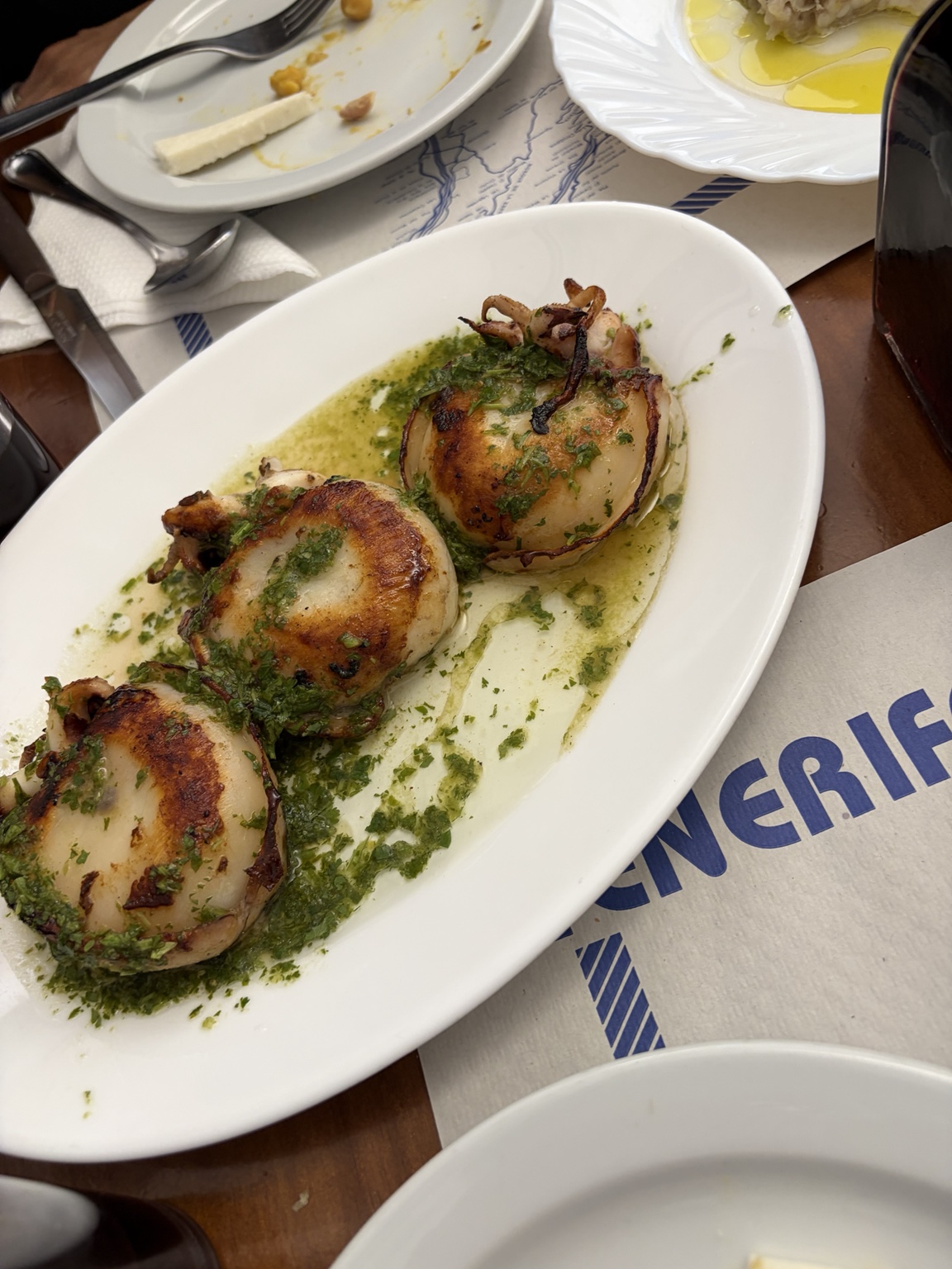 Grilled local seafood with a fresh herb sauce
