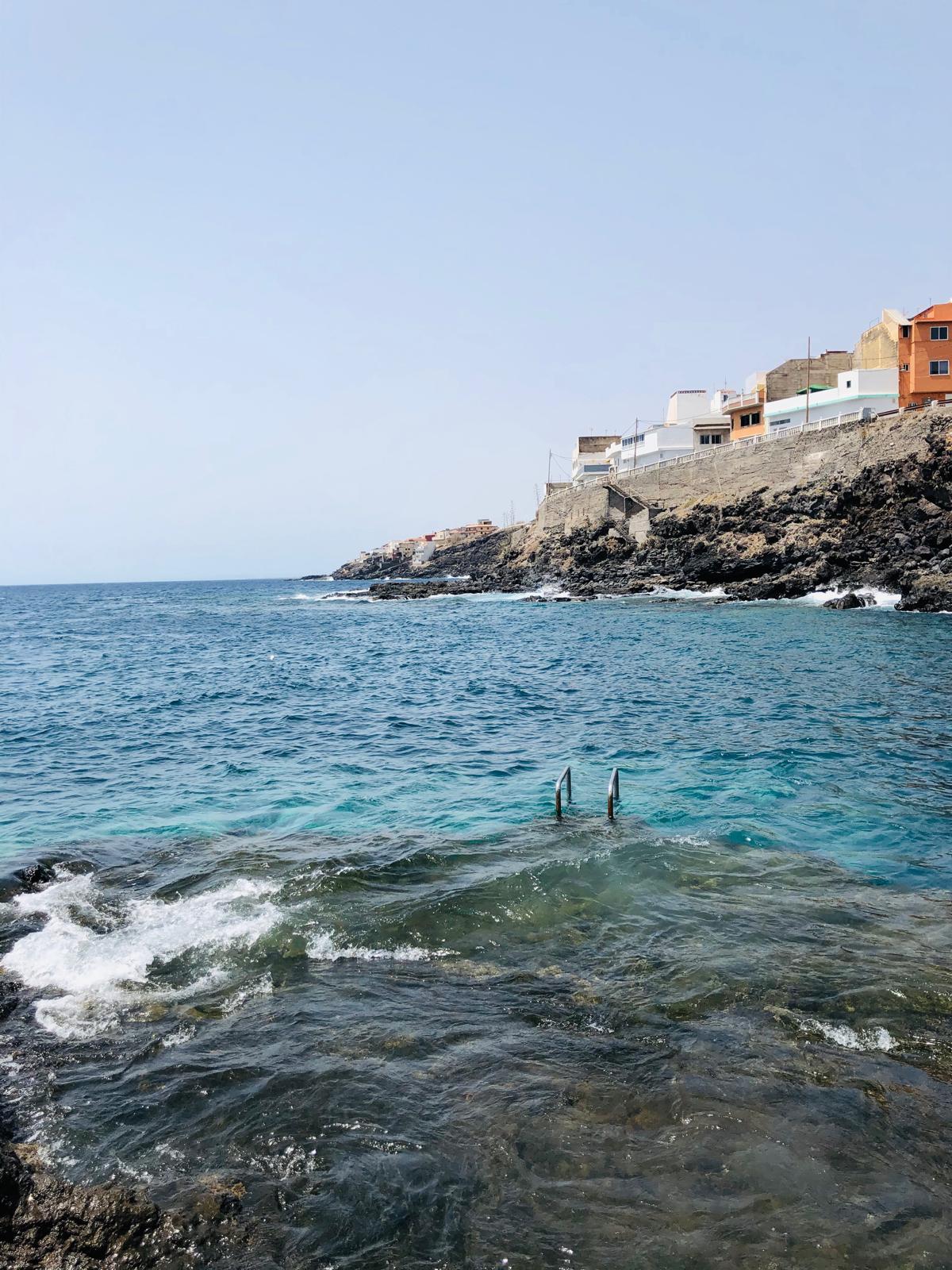A natural Atlantic swimming spot beside a Canarian fishing village